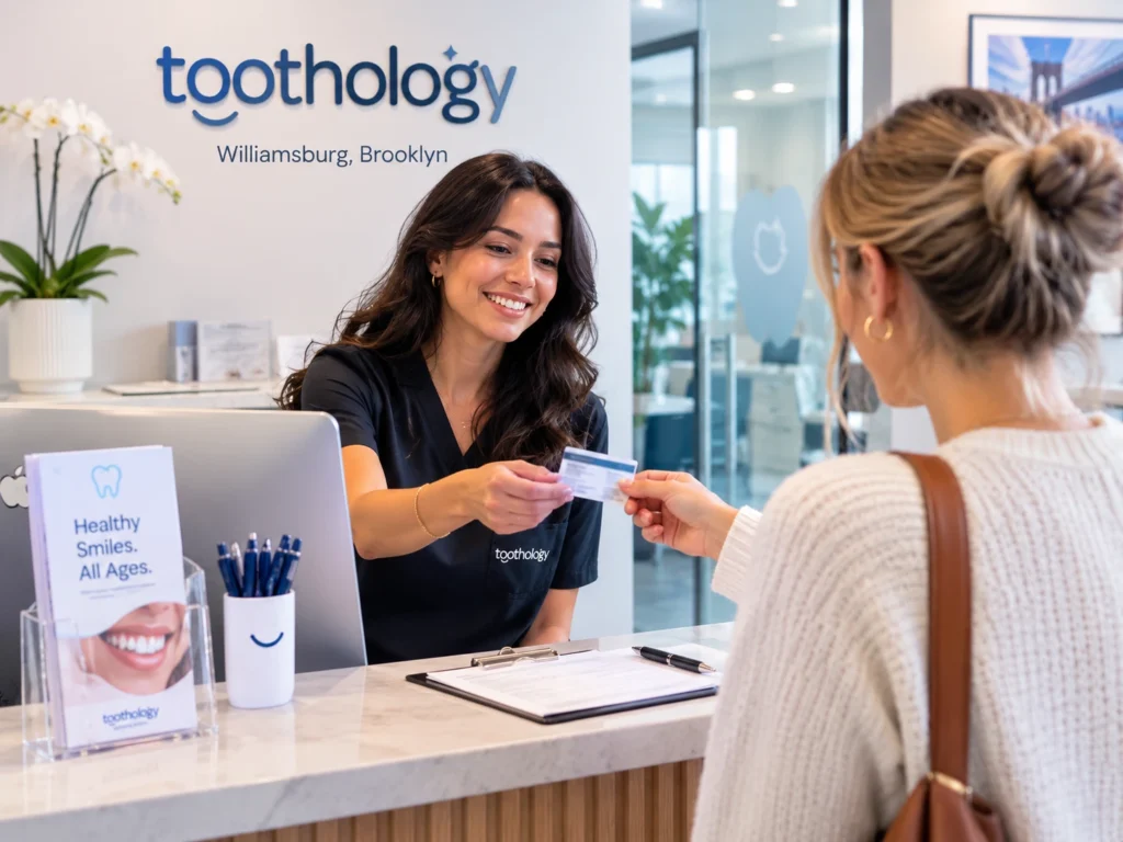 Checking dental insurance benefits at Toothology reception
