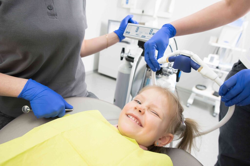 Child at Dental Chair, Smiling