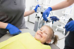 Child at Dental Chair, Smiling