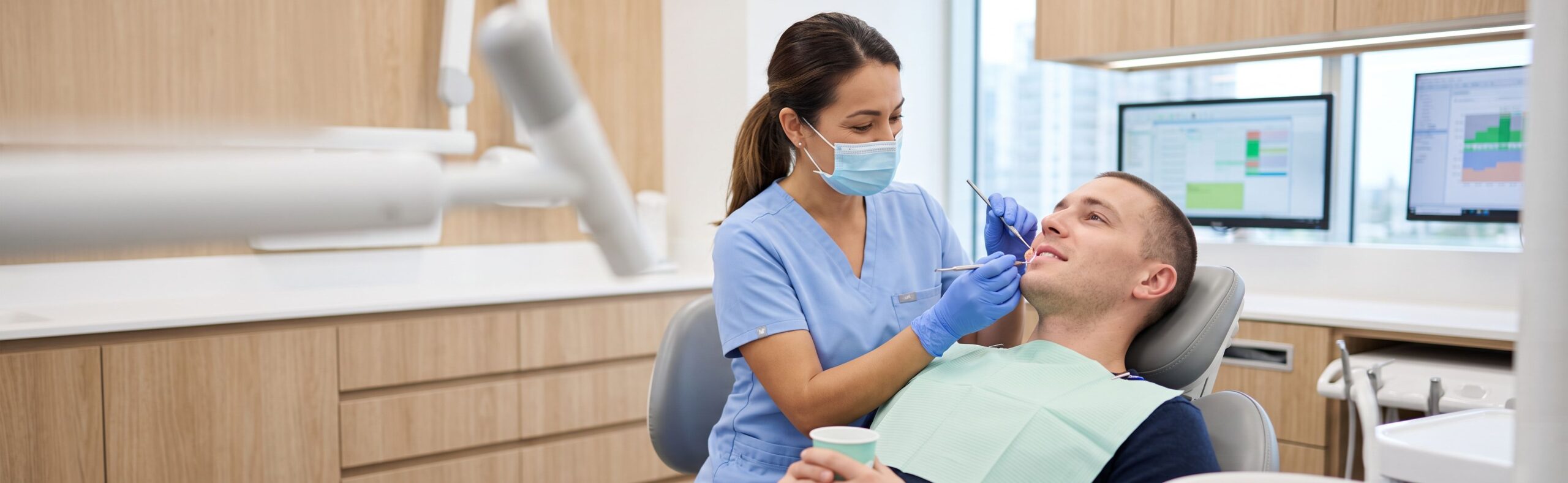 Dentist Examining Gum Area at Evaluation