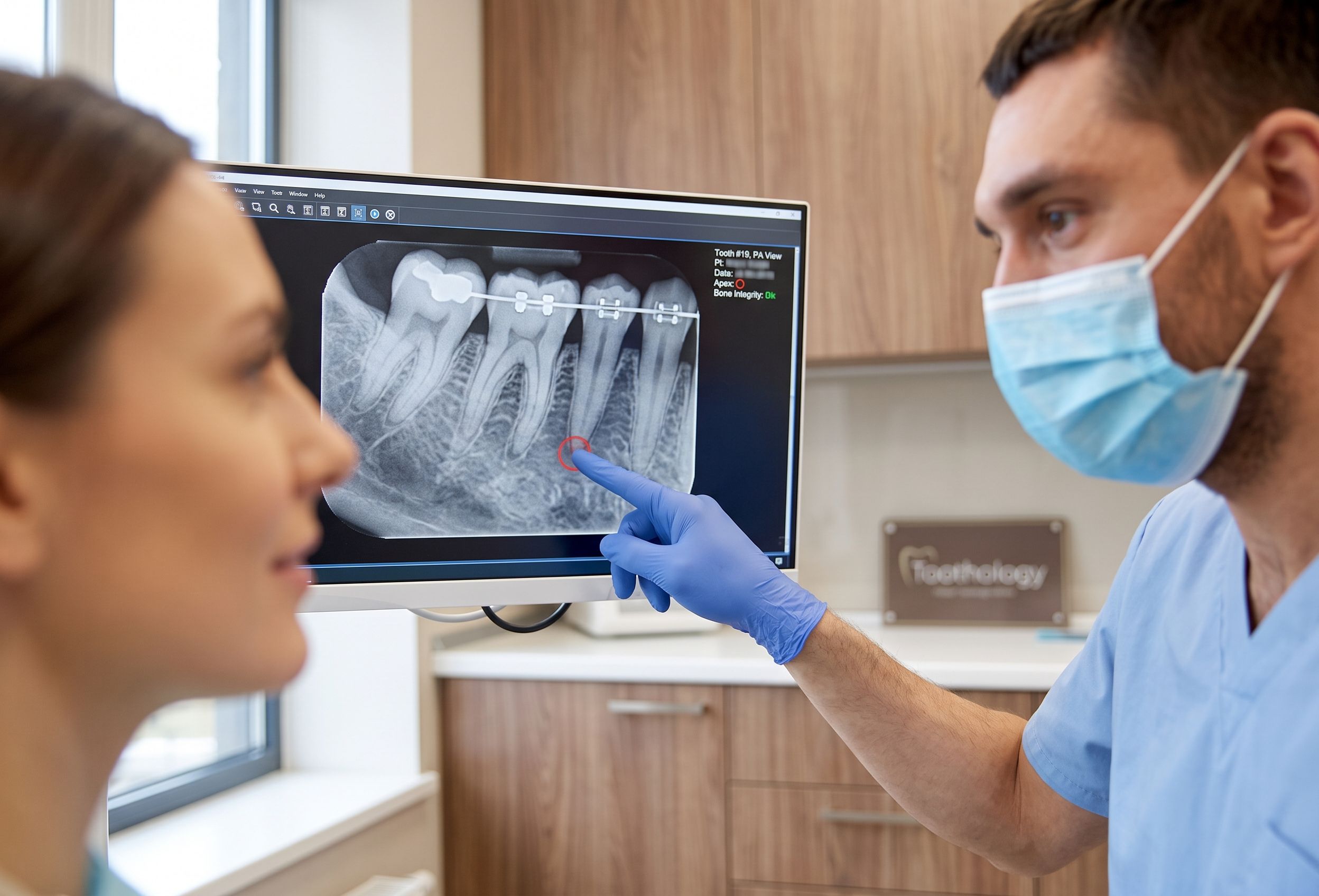 Dentist Reviewing Periapical X-Ray