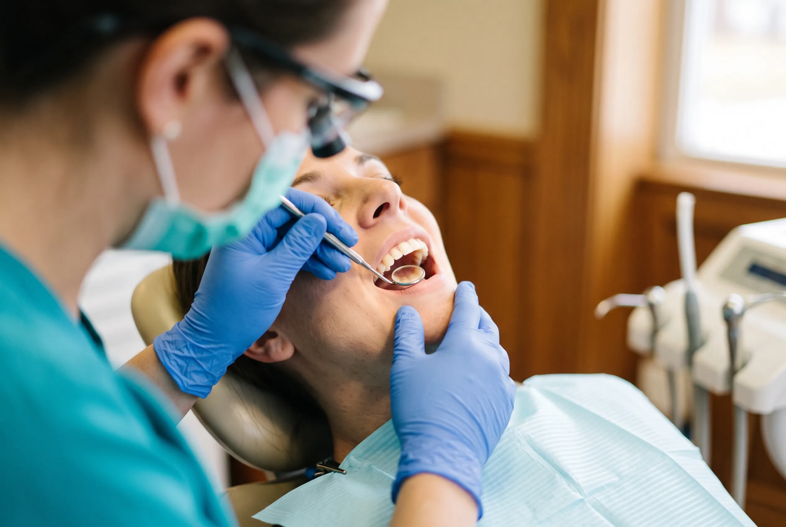 Dentist Examining Tooth — Clinical Close-Up