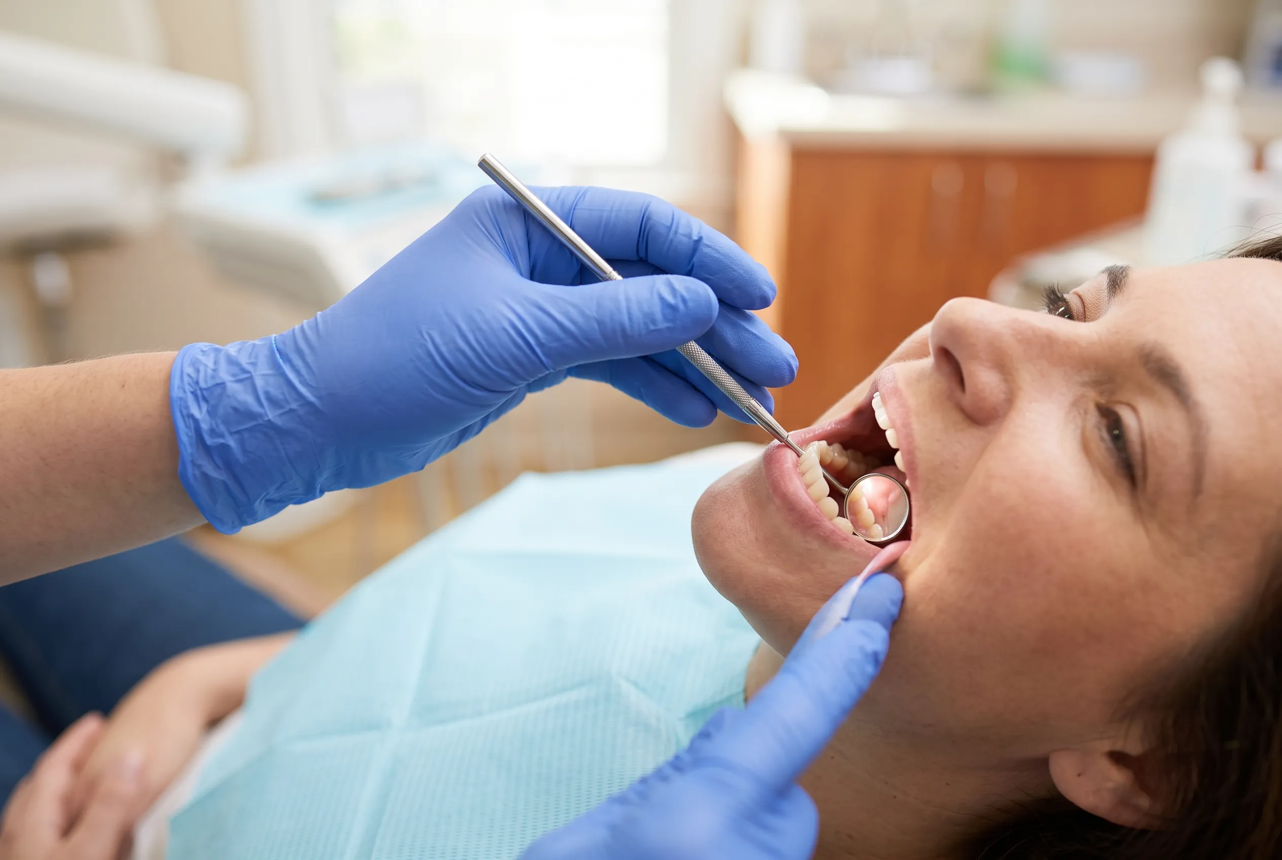 Gum Examination — Hygienist with Mirror